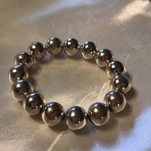 Large silver beads; stretchy bracelet